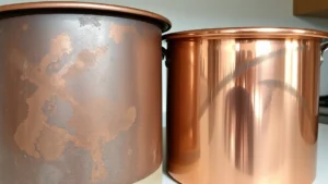 Close-up of tarnished copper pot next to polished copper pot, side-by-side comparison showing dark oxidized surface versus shiny reflective finish, natural kitchen lighting