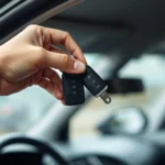 Close-up of hands holding a car key fob and vehicle key over an open car door, showing the interior dashboard and steering wheel in soft focus background, realistic automotive setting